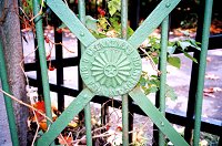 Manufacturer's medallion on gate